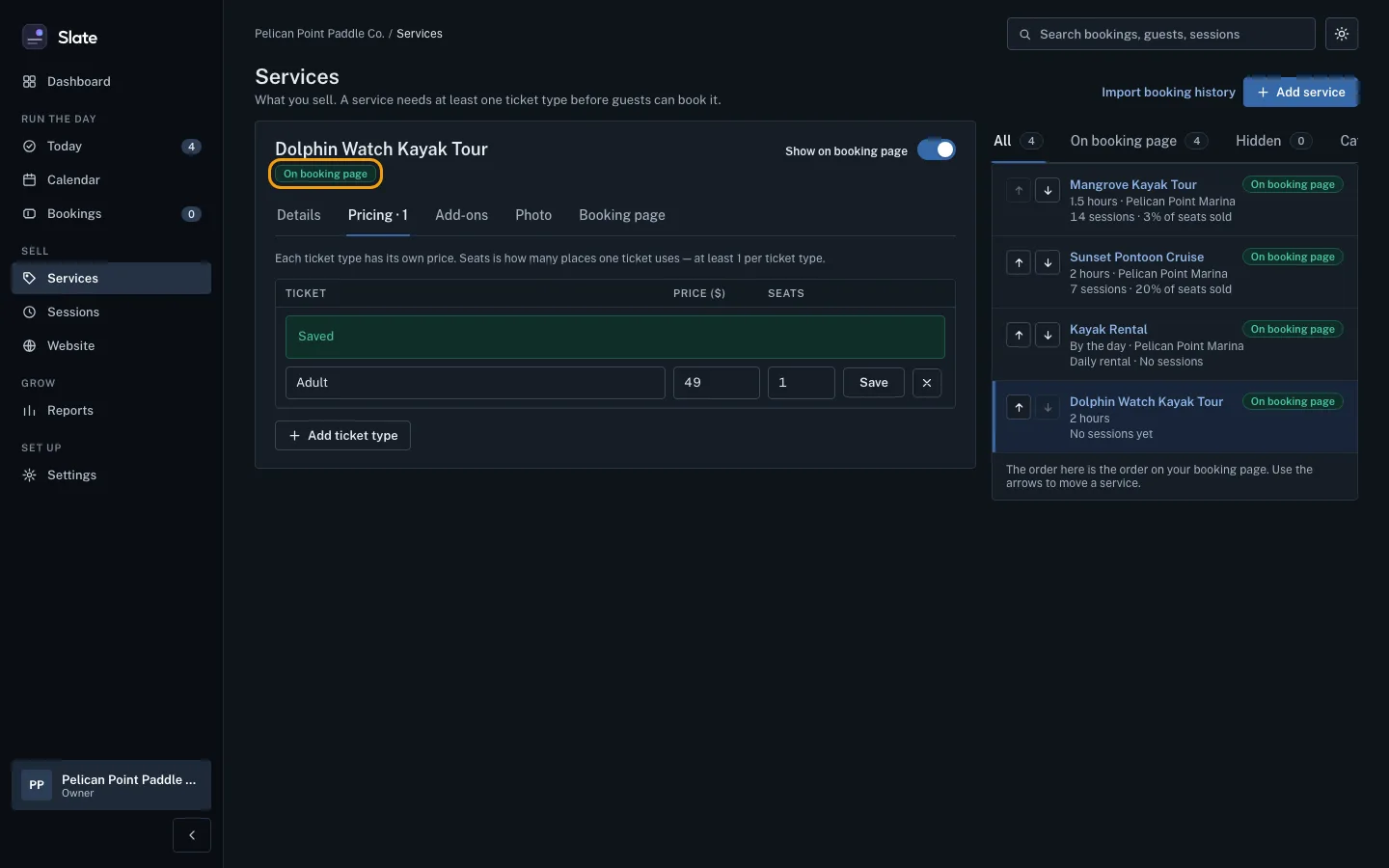 The Pricing tab after saving, with the Adult ticket listed and the experience label now reading On booking page, outlined.